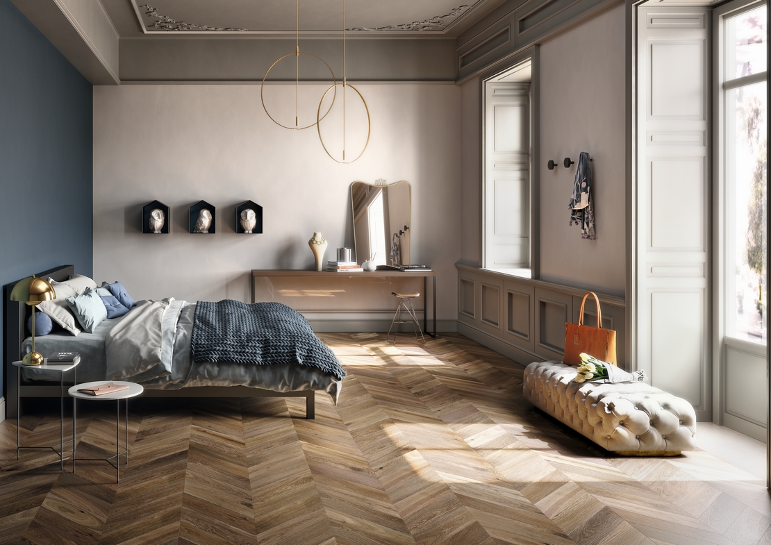 Elegant, modern, and vintage bedroom with classic brown herringbone parquet flooring