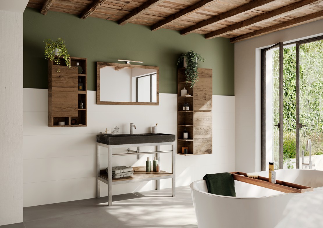Salle de bains moderne avec baignoire, revêtement blanc et sol effet béton - Inspirations Iperceramica