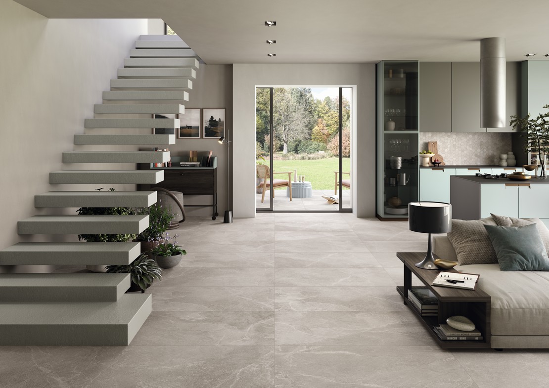 Modern open-plan living room with gray slate-effect flooring