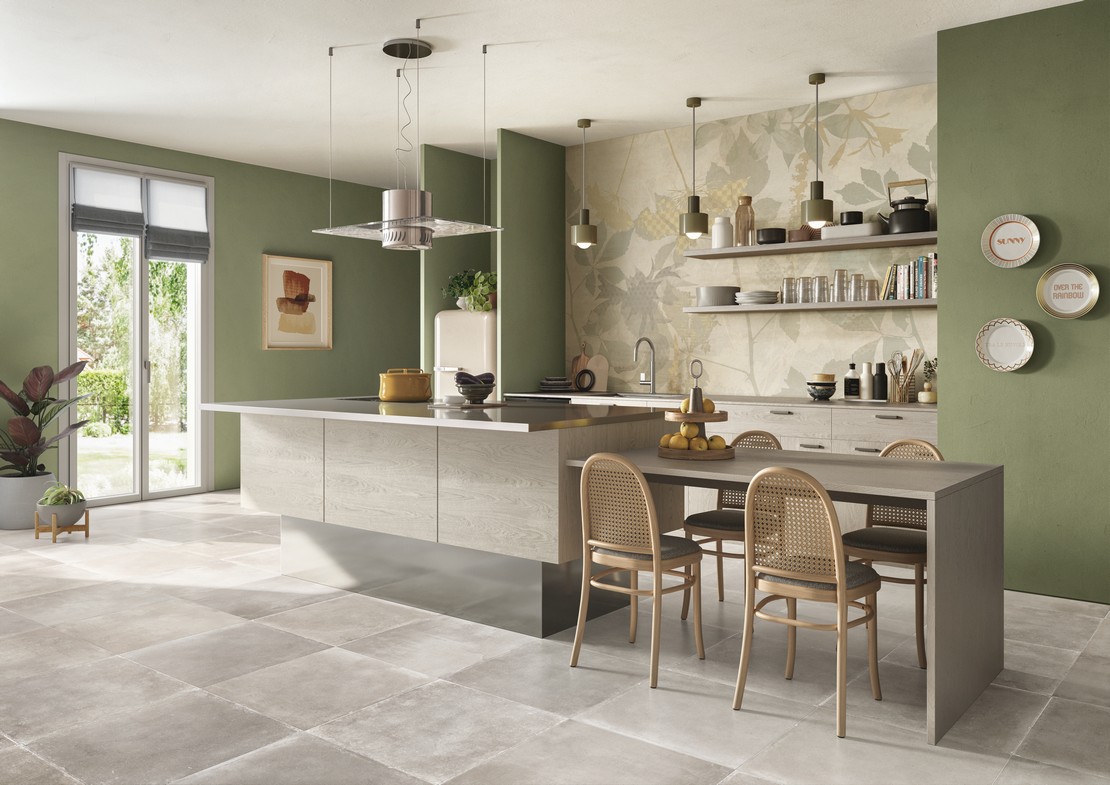 Cuisine moderne ouverte avec îlot central et papier peint. Sol effet béton. - Inspirations Iperceramica