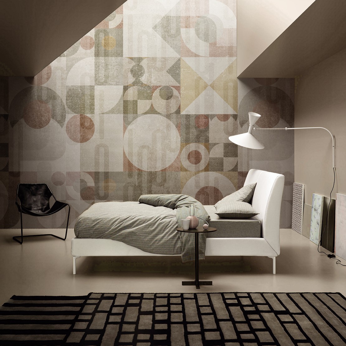 Modern industrial-style bedroom with wallpaper.