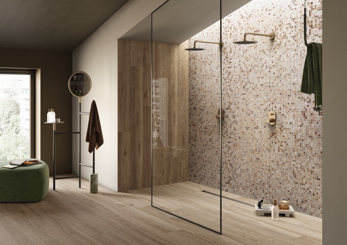 Minimalist luxury bathroom with mosaic shower, wood-effect flooring and wall tiles