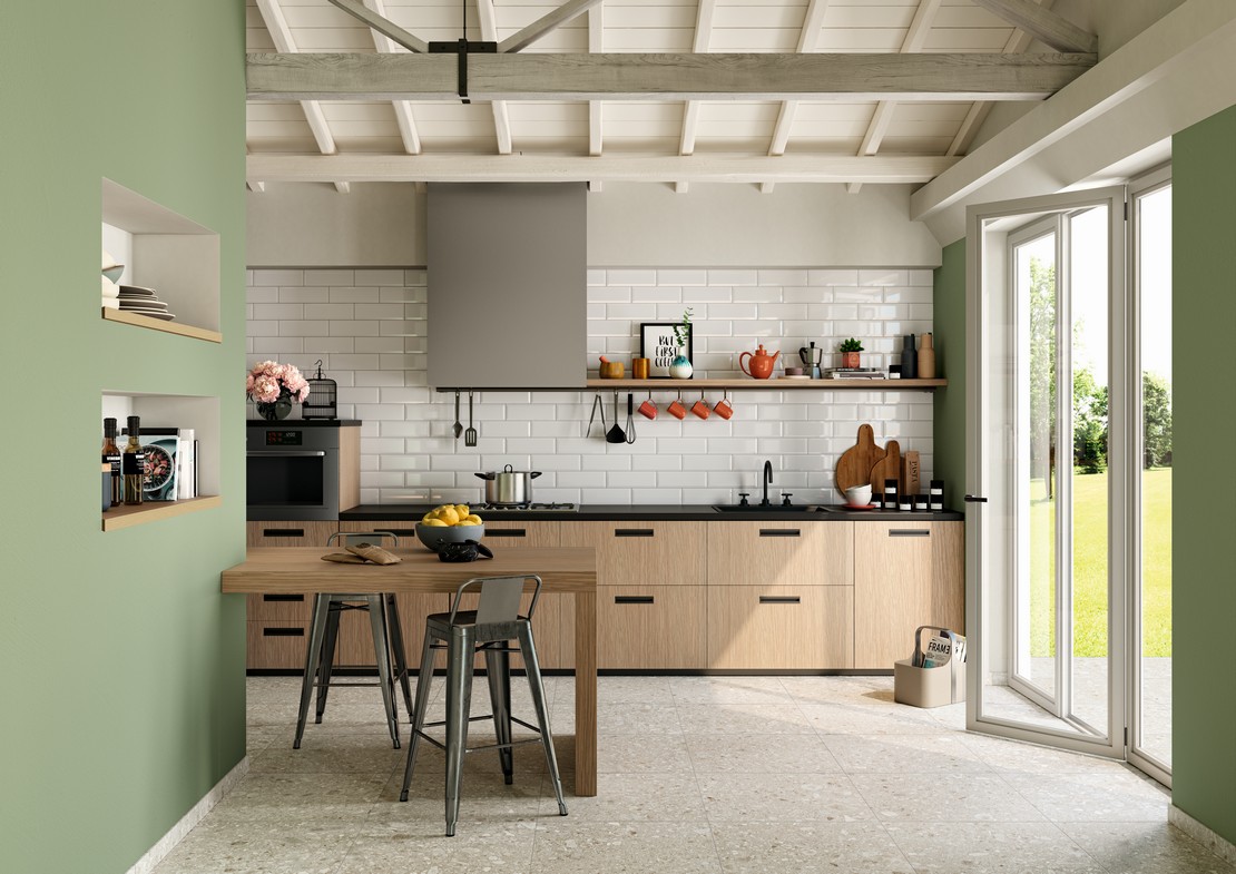 Modern industrial-style linear kitchen with stone-effect white tiles