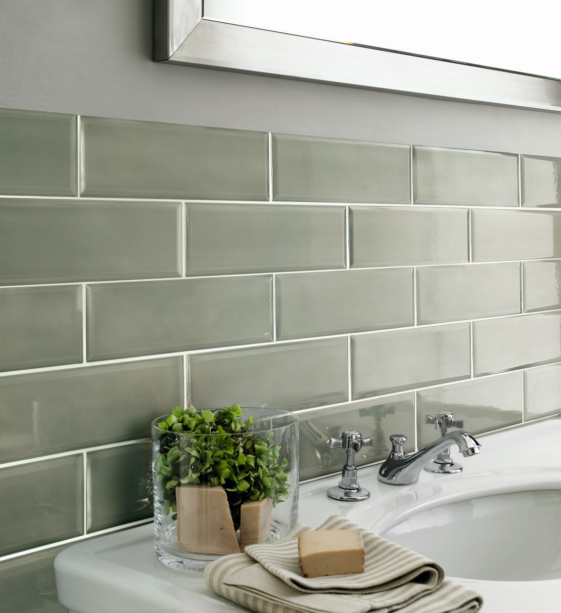 Colorful classic bathroom with sage green diamond-patterned wall tiles for a vintage feel