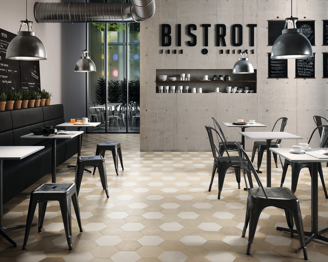 Ristorante in stile moderno industriale effetto cemento vintage - Ambienti Iperceramica