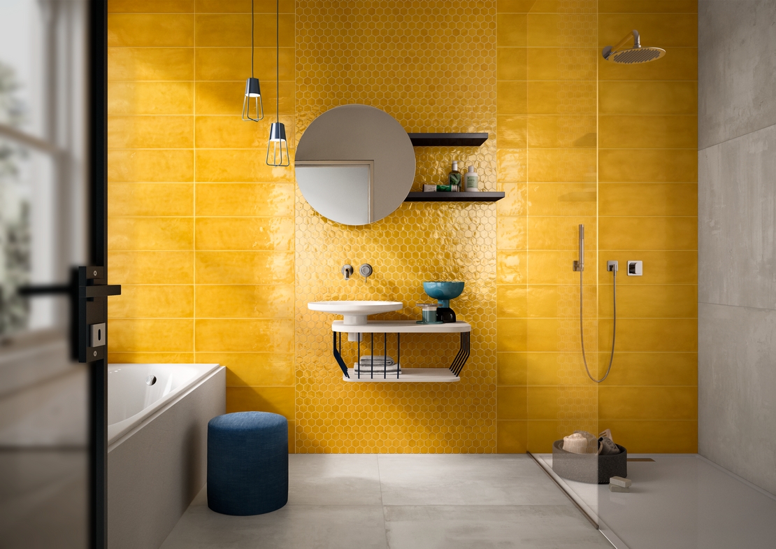 Colorful modern bathroom with shower and bathtub. Concrete effect and yellow wall tiles