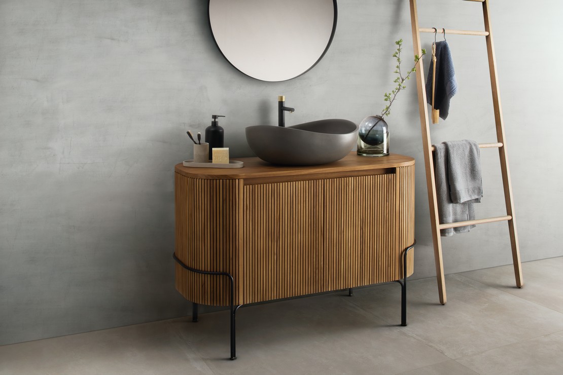 Small, modern bathroom with gray concrete effect.