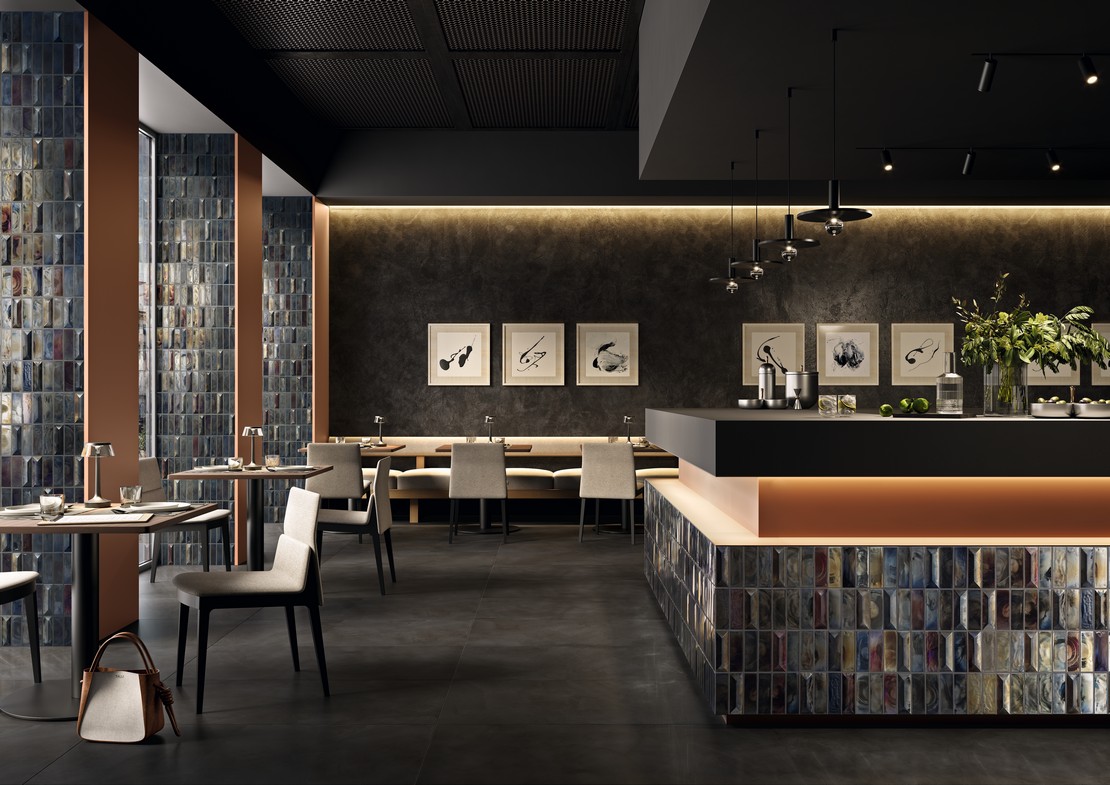 Modern industrial-style restaurant with metal-effect mosaic wall covering