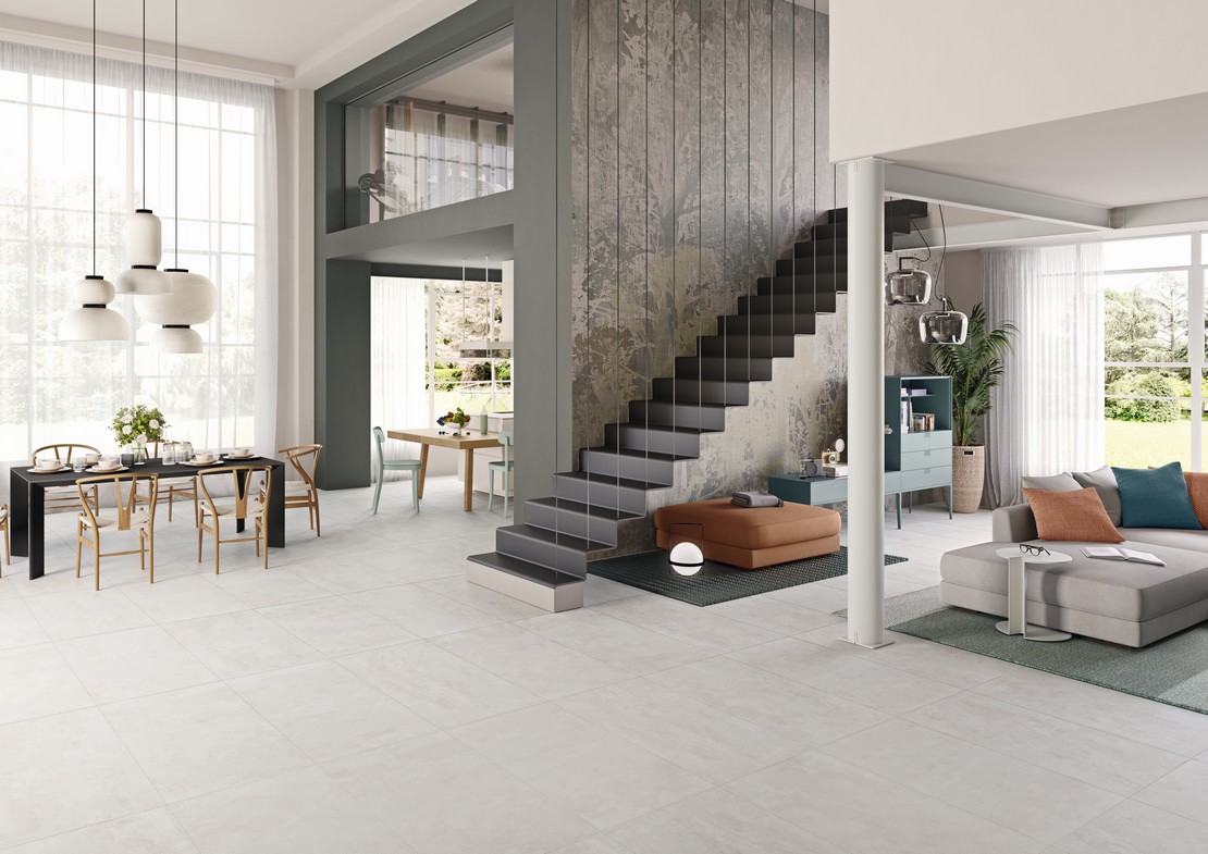 Modernes elegantes offenes Wohnzimmer im industriellen Stil mit Küche  - Inspirationen Iperceramica