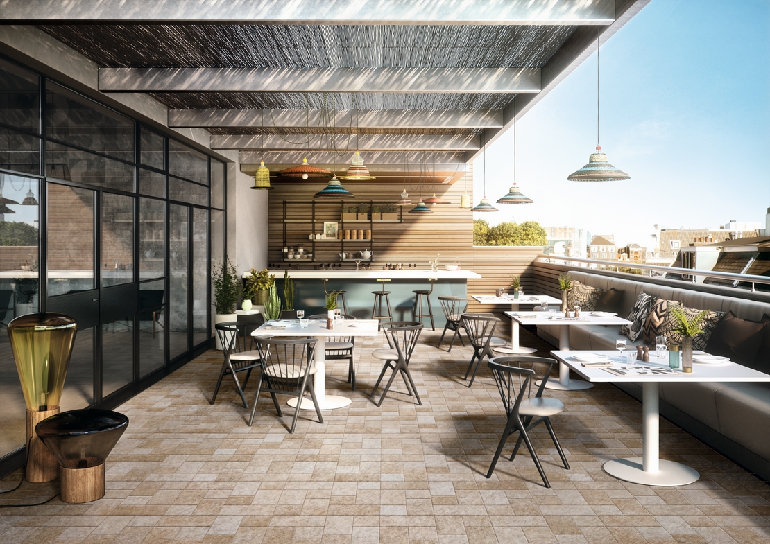 Rustikales Restaurant-Cafe mit beigem Feinsteinzeug in Steinoptik - Inspirationen Iperceramica