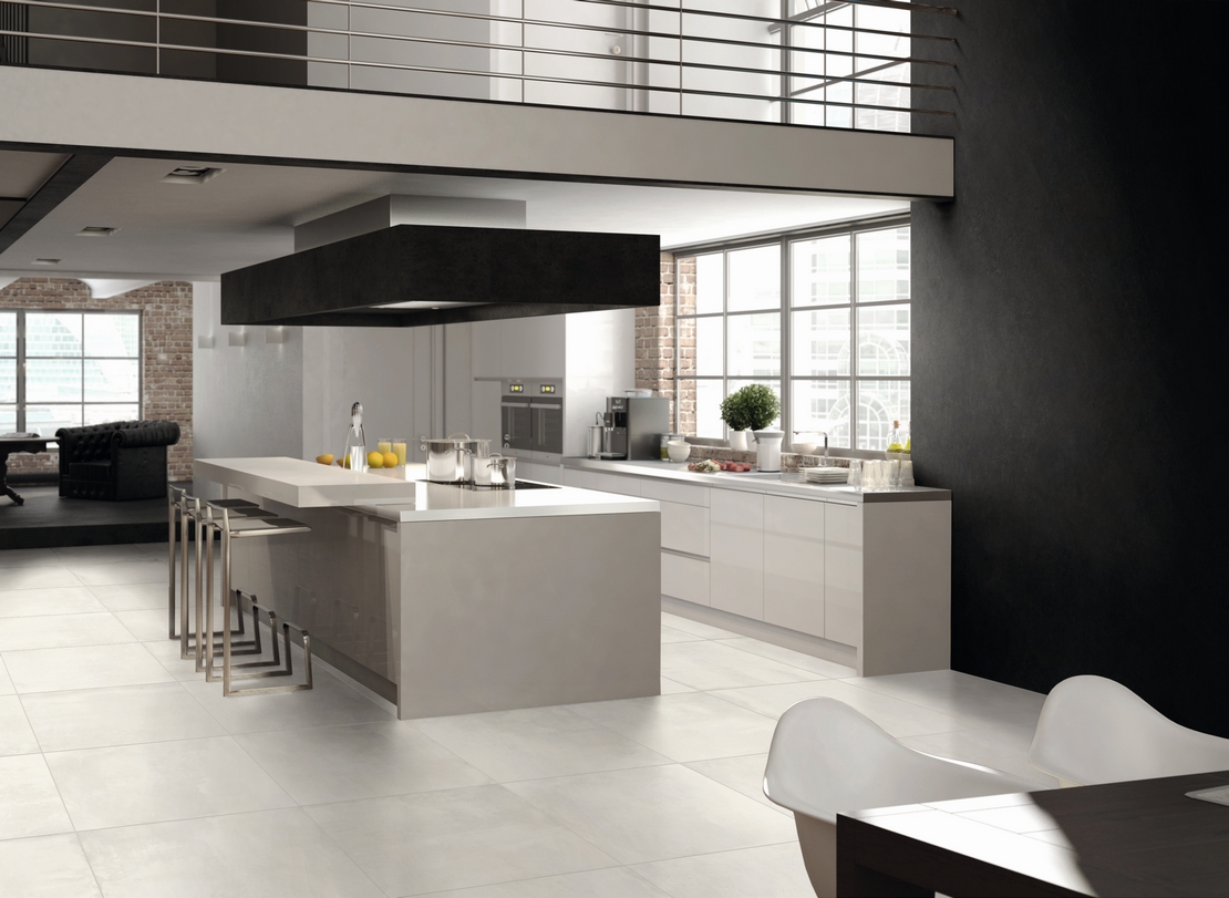Modern open-plan kitchen with island: concrete-effect tiles and white details for a luxurious touch