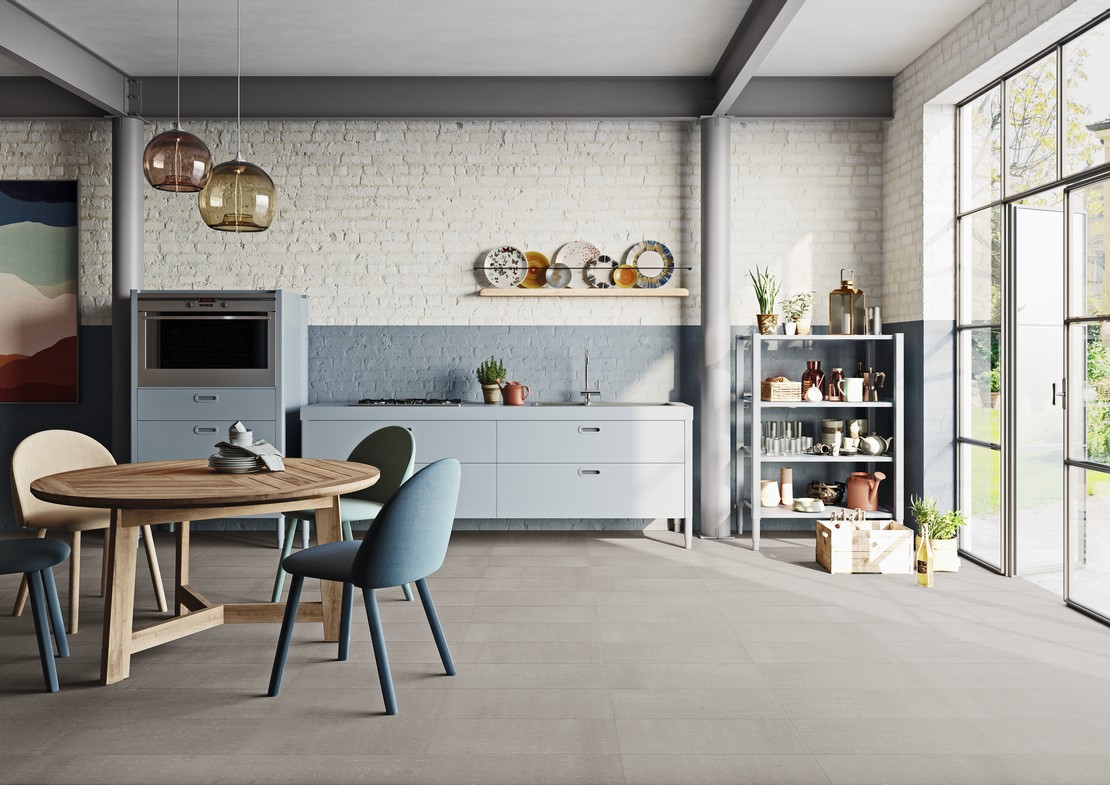 Industrial-style linear kitchen with gray concrete-effect flooring