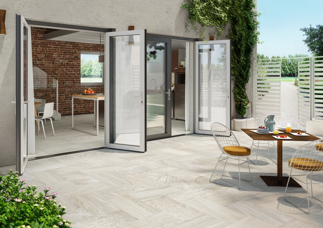 Modern patio with light stone-effect porcelain tile flooring