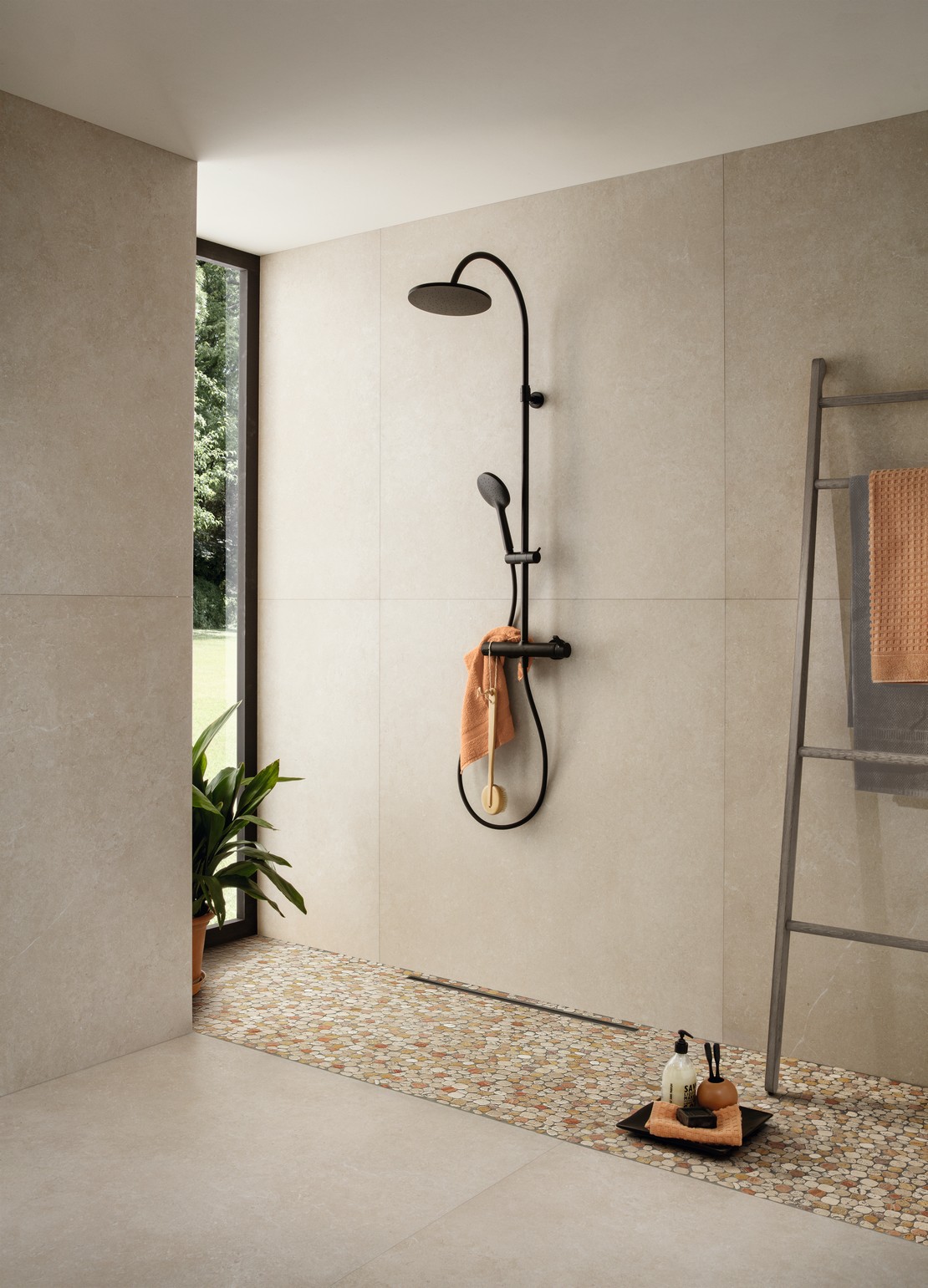 Luxury minimalist bathroom, shower with marble mosaic, stone-effect flooring and wall tiles