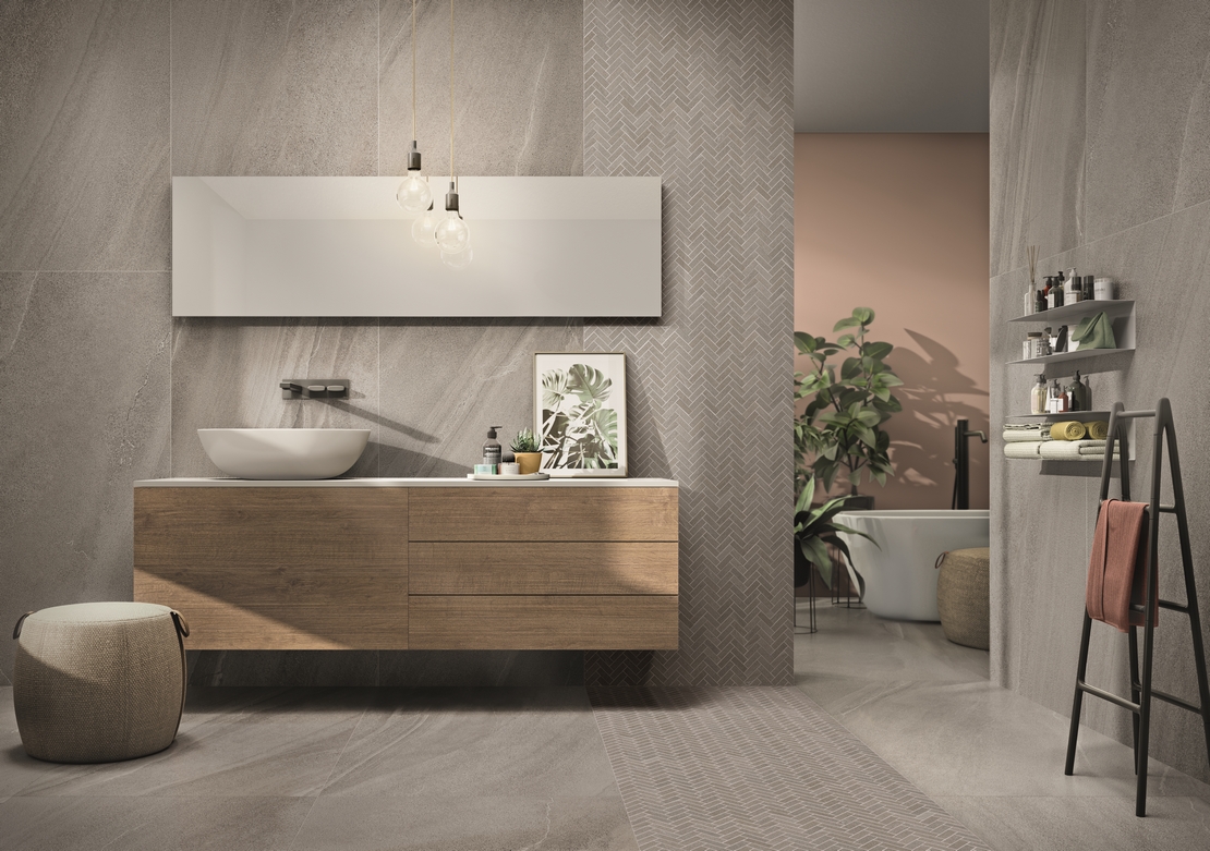 Modernes Badezimmer mit Badewanne. Minimalistische graue Steinoptik für einen industriellen Stil - Inspirationen Iperceramica