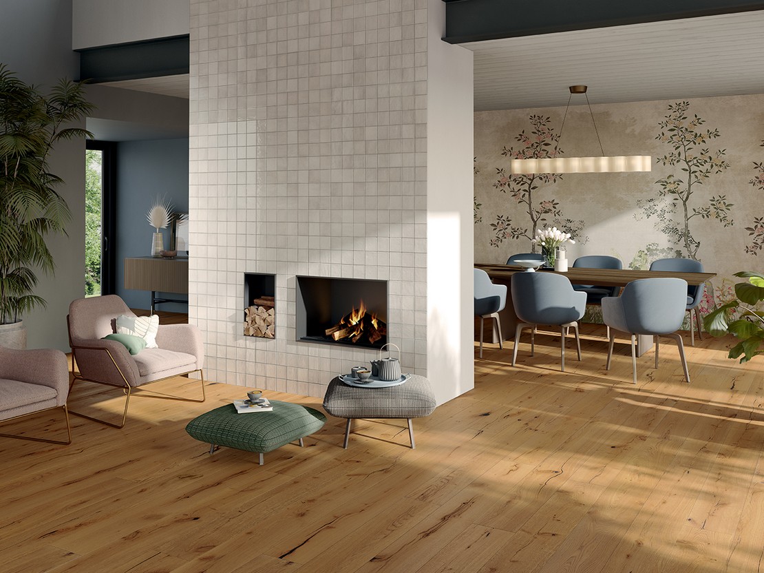 Modern open-plan living room with wood-effect flooring and wallpaper