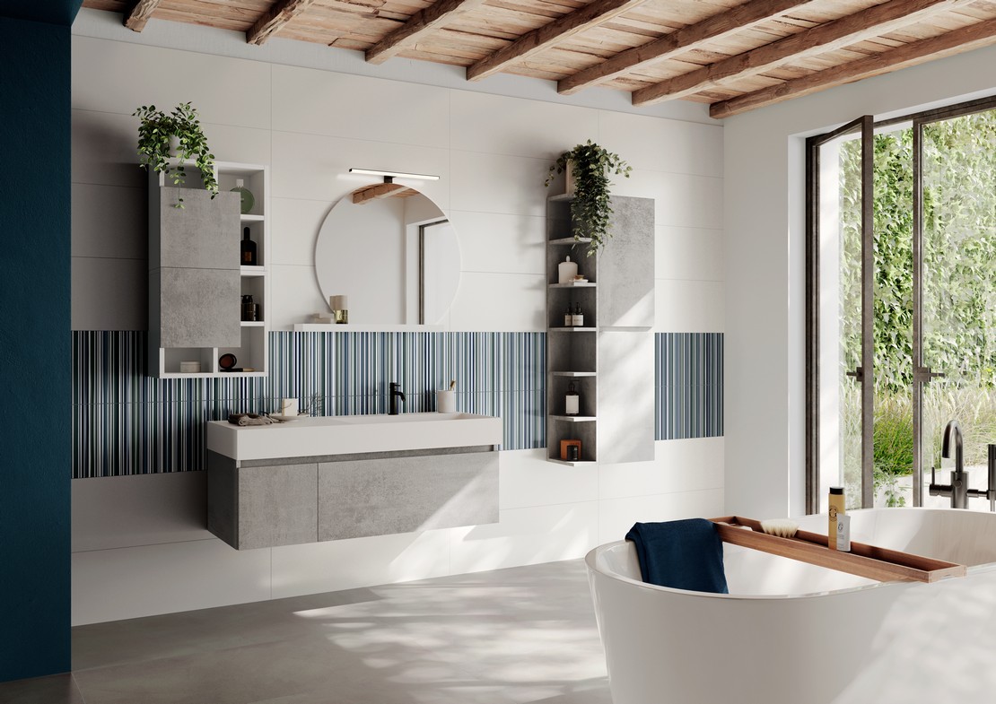 Bagno moderno con vasca e pavimento effetto cemento grigio - Ambienti Iperceramica