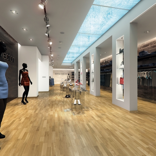 Modern store with beige parquet and white walls