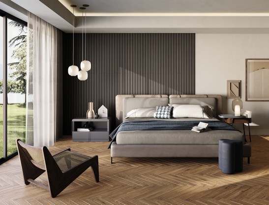 Luxury bedroom with brown wooden flooring and gray walls