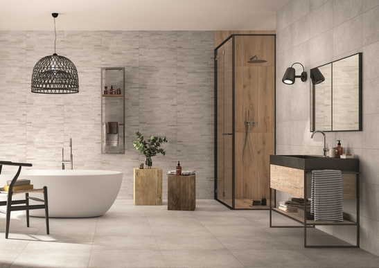Bagno moderno minimalista con vasca e doccia. pietra grigia e stile industriale