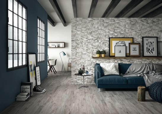 Modern gray and blue living room with rustic stone-effect tiles