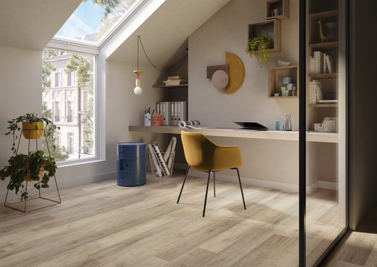 Modern home office with light-toned wood-effect flooring