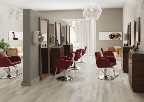 Modern store with gray wood-effect PVC flooring and white tones