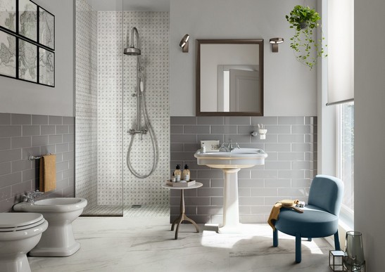 Classic vintage bathroom with marble mosaic shower and marble-effect floor.