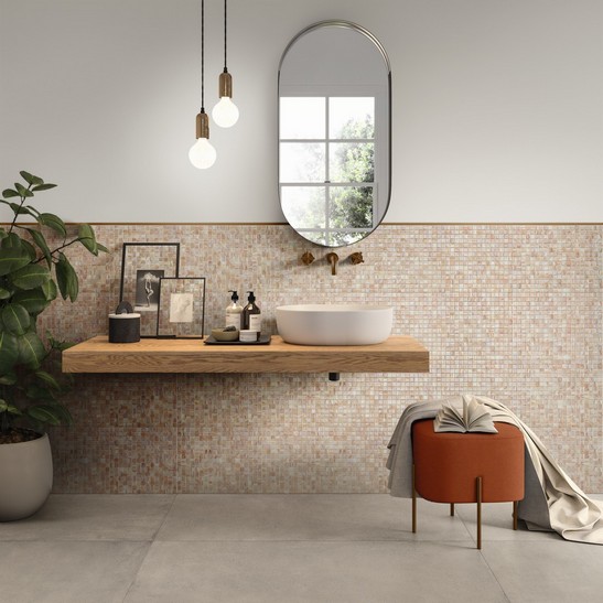 Classic luxury bathroom, concrete effect flooring and gold mosaic wall tiles.