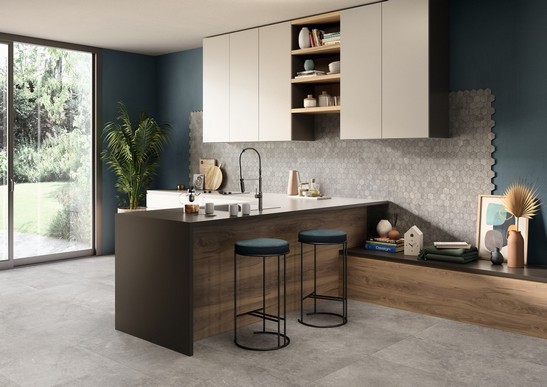 Modern luxury kitchen with peninsula and stone-effect stoneware flooring