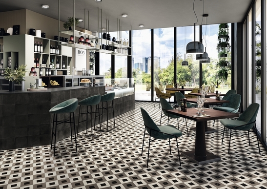 Bar-restaurant moderne, grès cérame effet carreau de ciment vintage décoré et tons gris-noir.