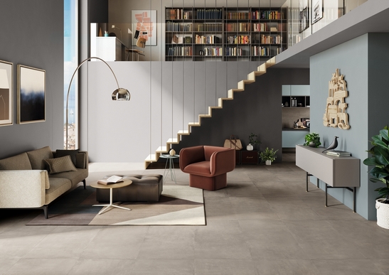 Modernes offenes Wohnzimmer: Boden in Zementoptik, Grau- und Blautöne