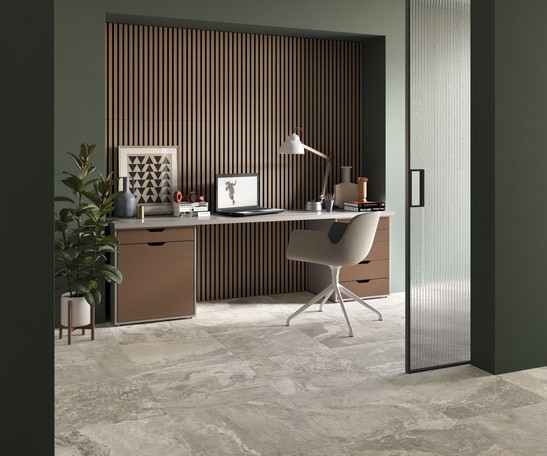 Modern office studio with gray stone-effect flooring and wood paneling