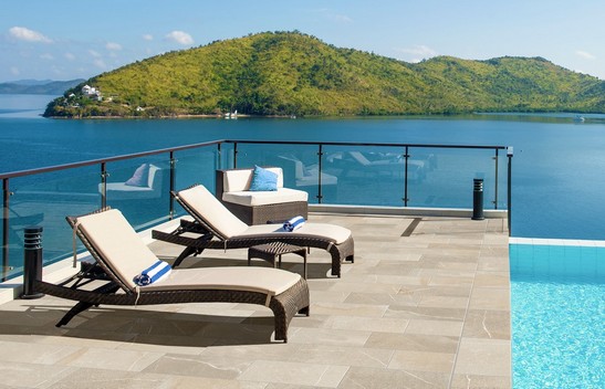 Modern pool patio, stone-effect flooring
