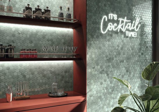Modern and colorful bar with green mosaic wall covering