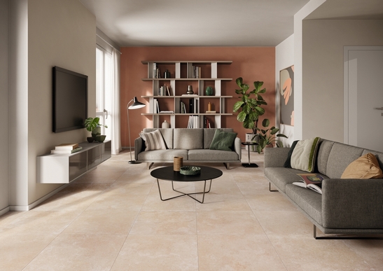 Modern living room, beige stone-effect flooring and shades of red for an elegant touch
