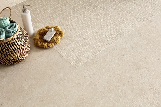 Modern bathroom with rustic-style beige stone-effect mosaic shower wall tiles