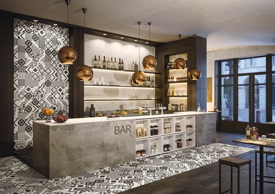 Rustic restaurant-bar, cement tile-effect stoneware flooring in shades of black and white