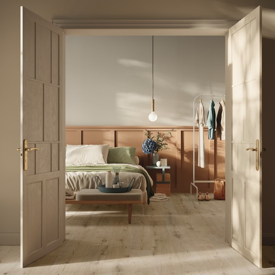 Camera da letto vintage ed elegante con pavimento effetto legno beige
