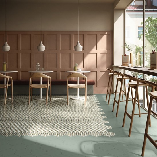 Modern colorful restaurant bar with colored cement tile flooring