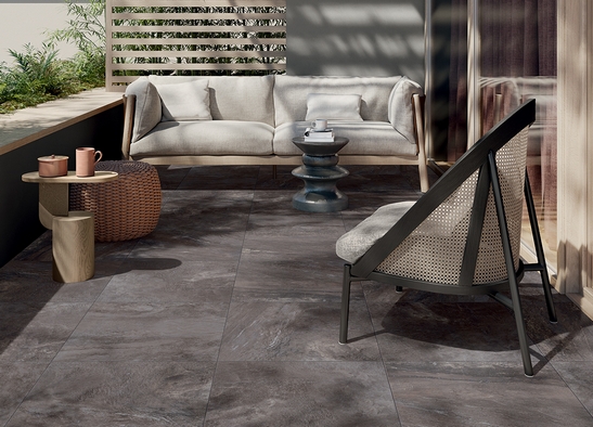 Modern balcony in dark tones, black stone-effect stoneware flooring